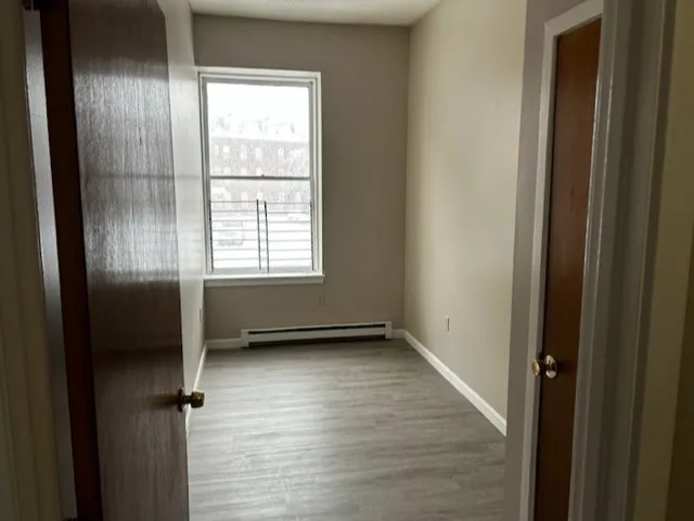 a view of an empty room with a window