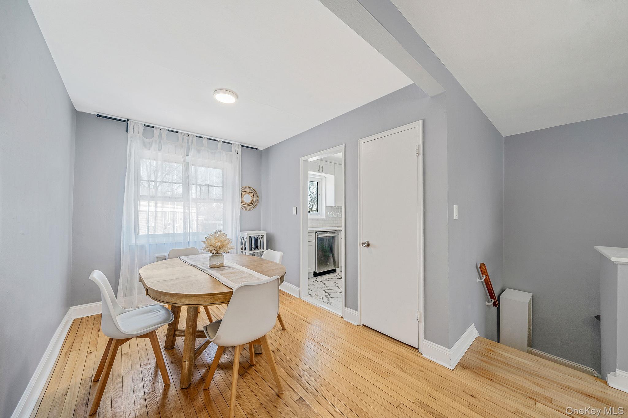 224-24 Manor Road, Unit UPPR Queens, NY 11427 - Photo 12 of 25 a dining room with furniture and window
