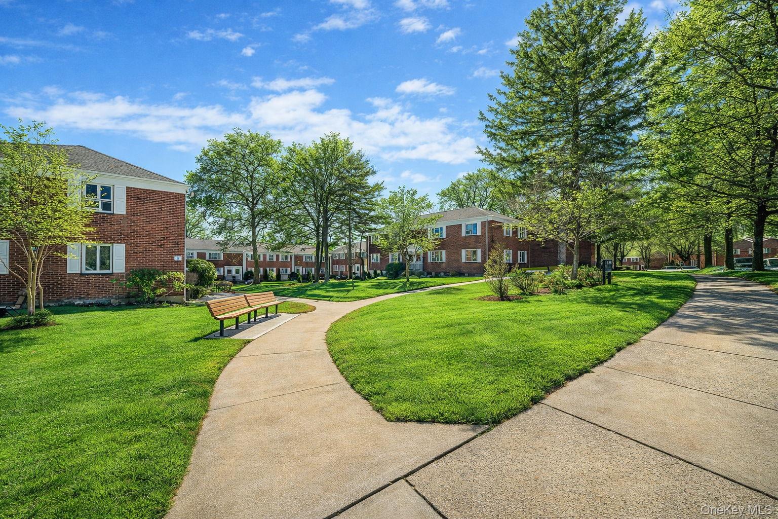 224-24 Manor Road, Unit UPPR Queens, NY 11427 - Photo 4 of 25 a view of a park with large trees