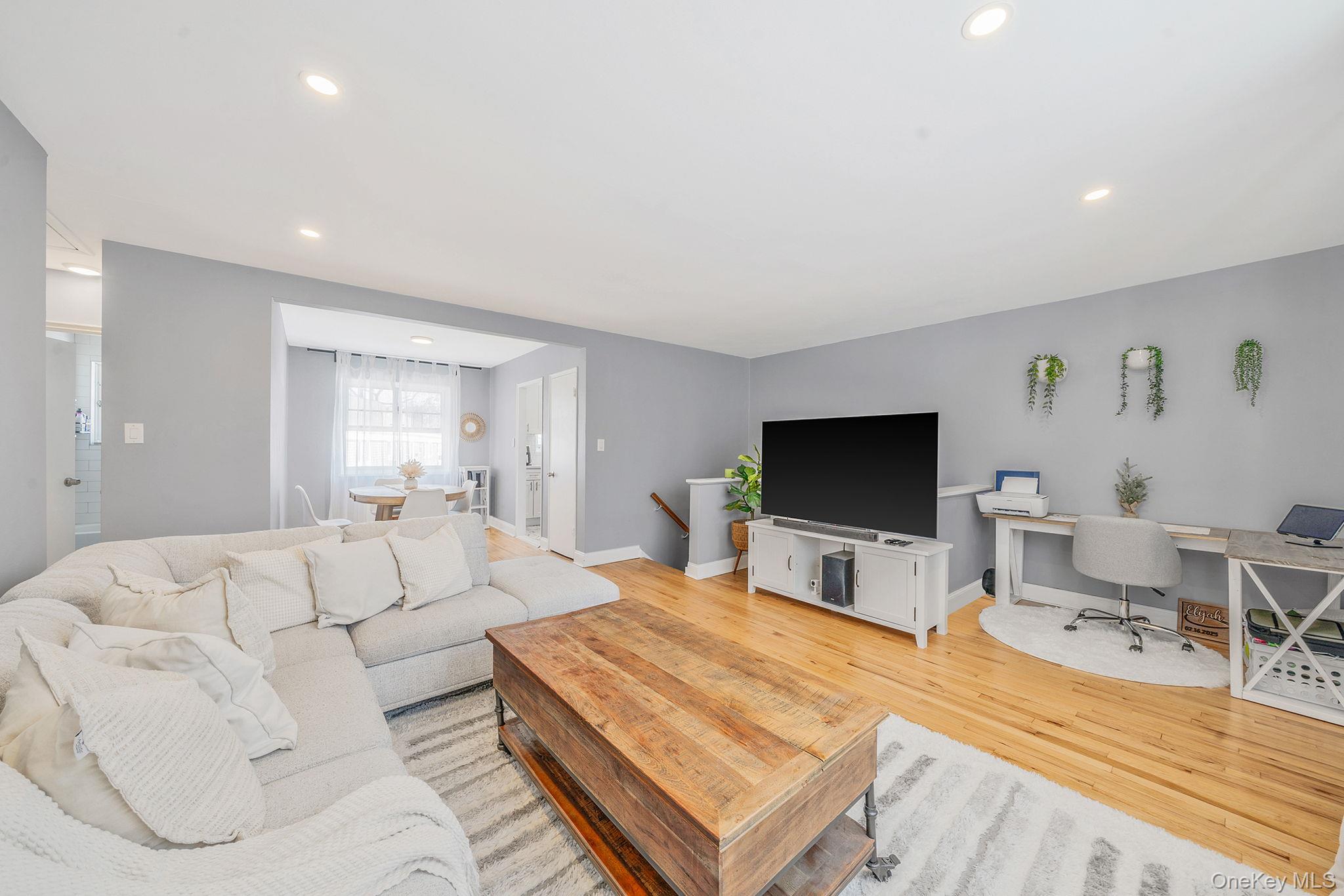 224-24 Manor Road, Unit UPPR Queens, NY 11427 - Photo 7 of 25 a living room with furniture and a flat screen tv