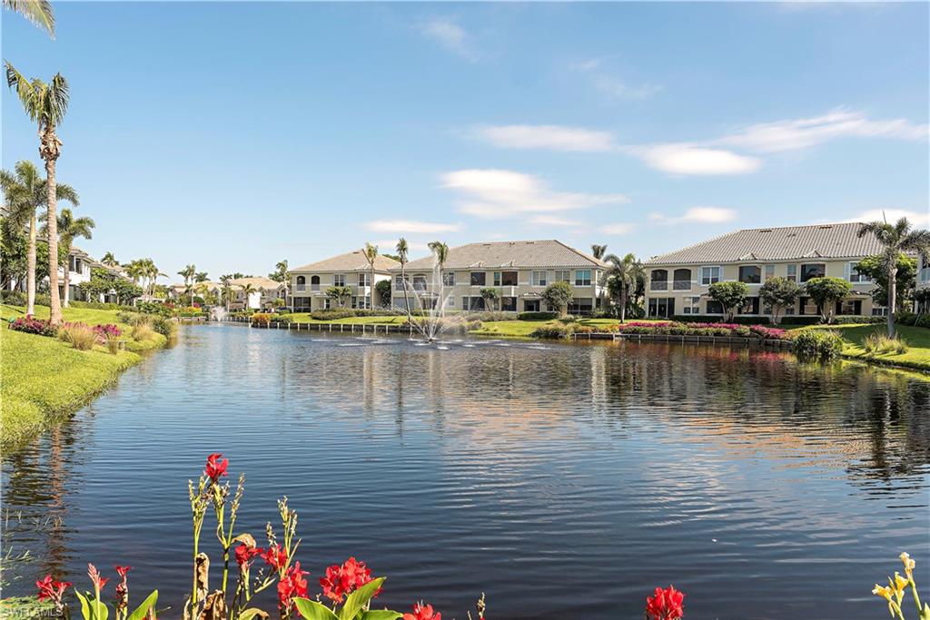 166 Colonade Circle Naples, FL 34103 - Photo 23 of 27 a view of a lake with houses