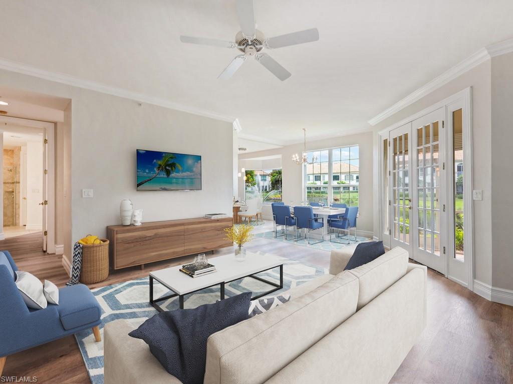 166 Colonade Circle Naples, FL 34103 - Photo 7 of 27 a living room with furniture and a large window