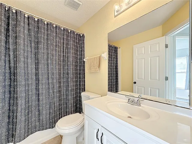 an aerial view of a house with a swimming pool