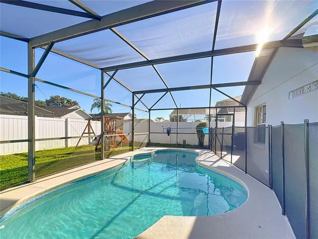 a view of a swimming pool with a patio