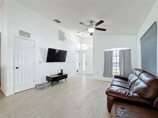 a kitchen with stainless steel appliances a stove a refrigerator and cabinets