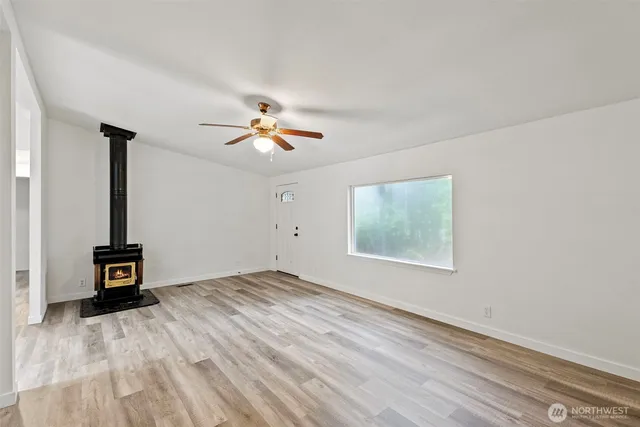 a view of livingroom with natural light and wooden floor
