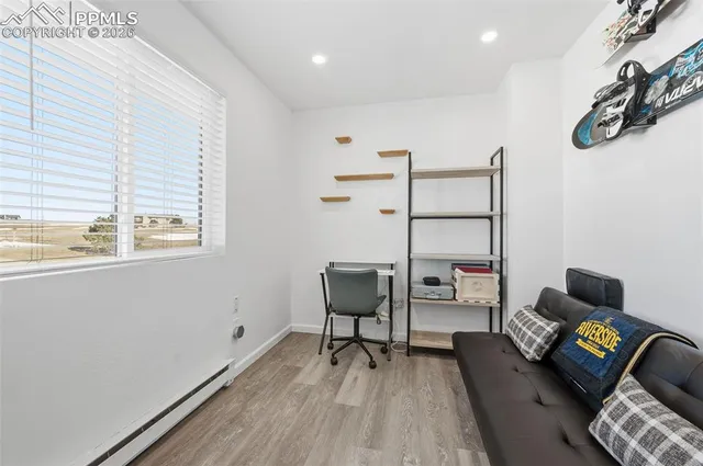 a workspace with furniture and window