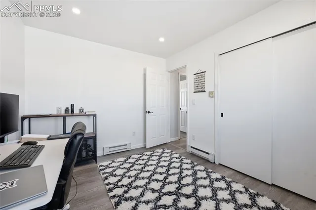 a bedroom with a bed and a sink