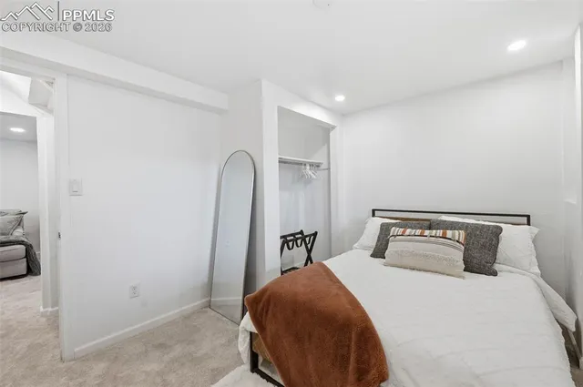 a bedroom with a bed and closet