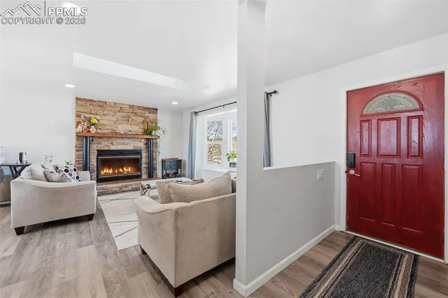 a living room with furniture and a fireplace