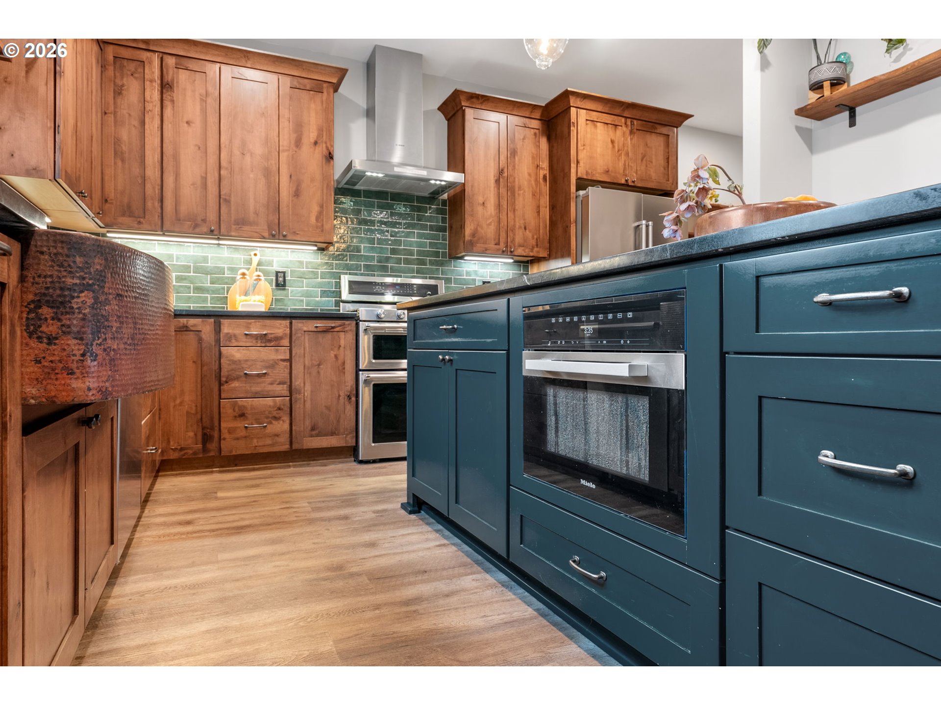 1114 9th Street Hood River, OR 97031 - Photo 12 of 48 a kitchen with granite countertop wooden cabinets and stainless steel appliances
