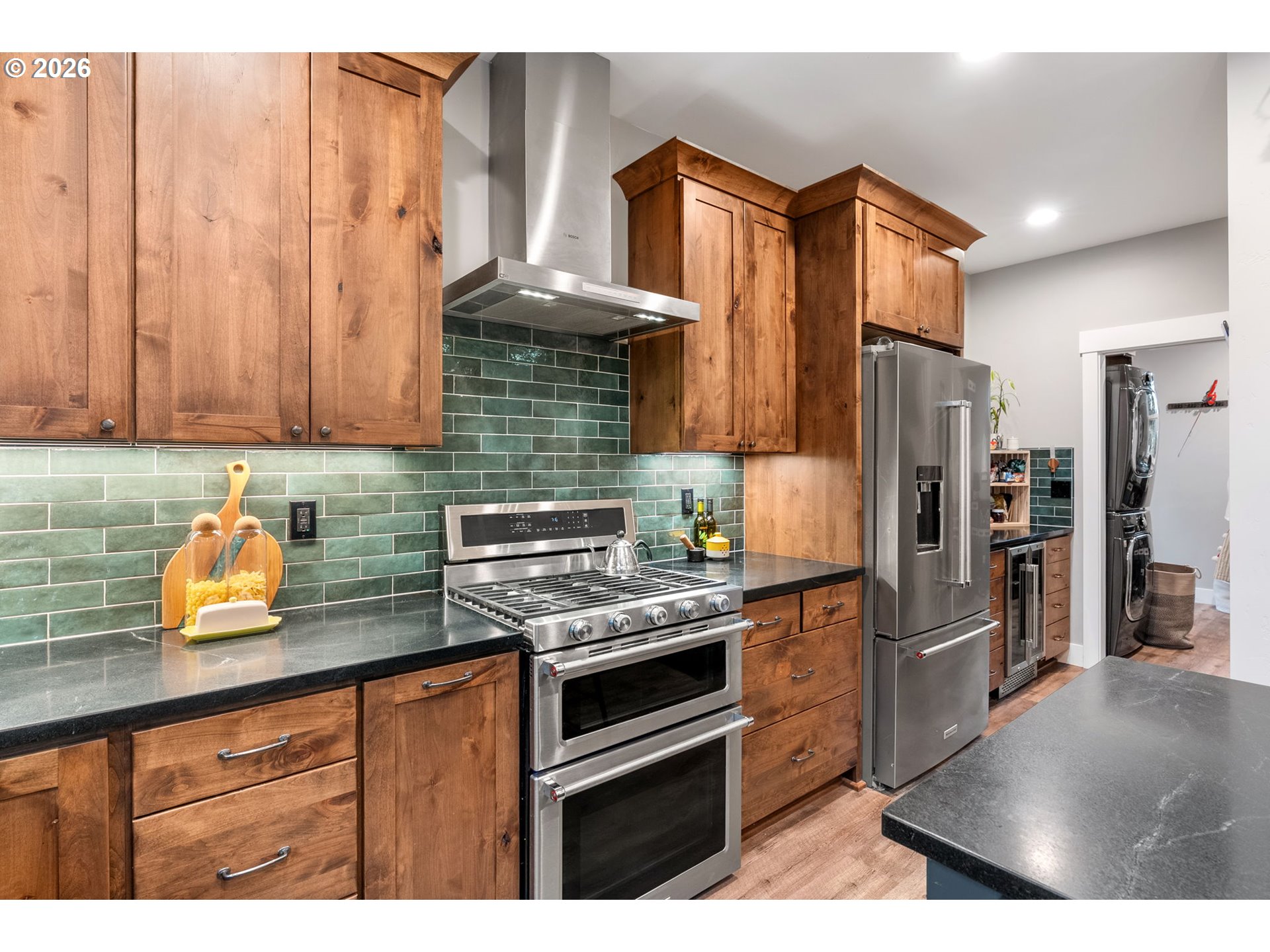 1114 9th Street Hood River, OR 97031 - Photo 13 of 48 a kitchen with stainless steel appliances a refrigerator a stove and cabinets