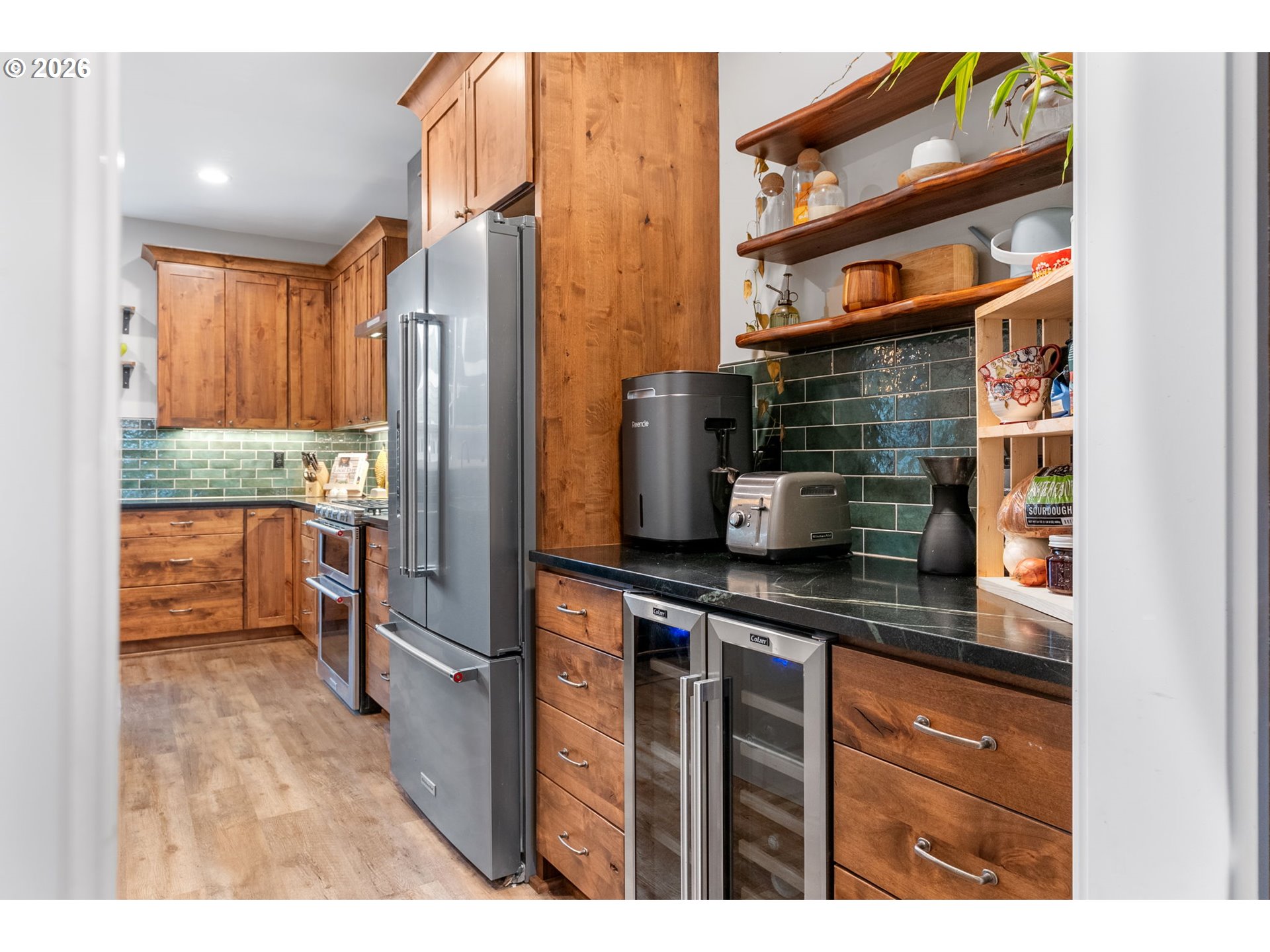 1114 9th Street Hood River, OR 97031 - Photo 14 of 48 a kitchen with stainless steel appliances granite countertop a refrigerator and a stove top oven