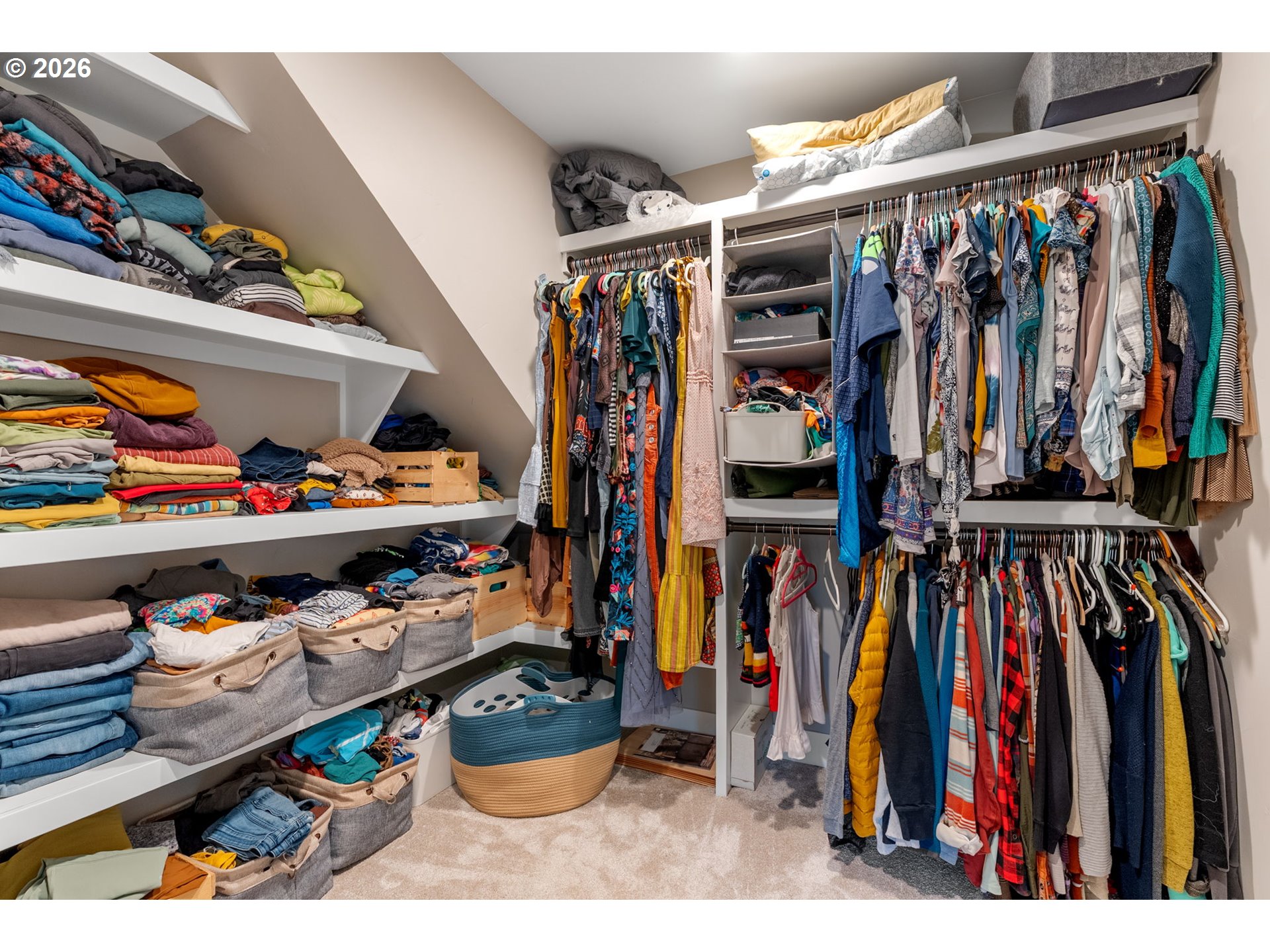1114 9th Street Hood River, OR 97031 - Photo 27 of 48 a view of walk in closet with clothes and shoes