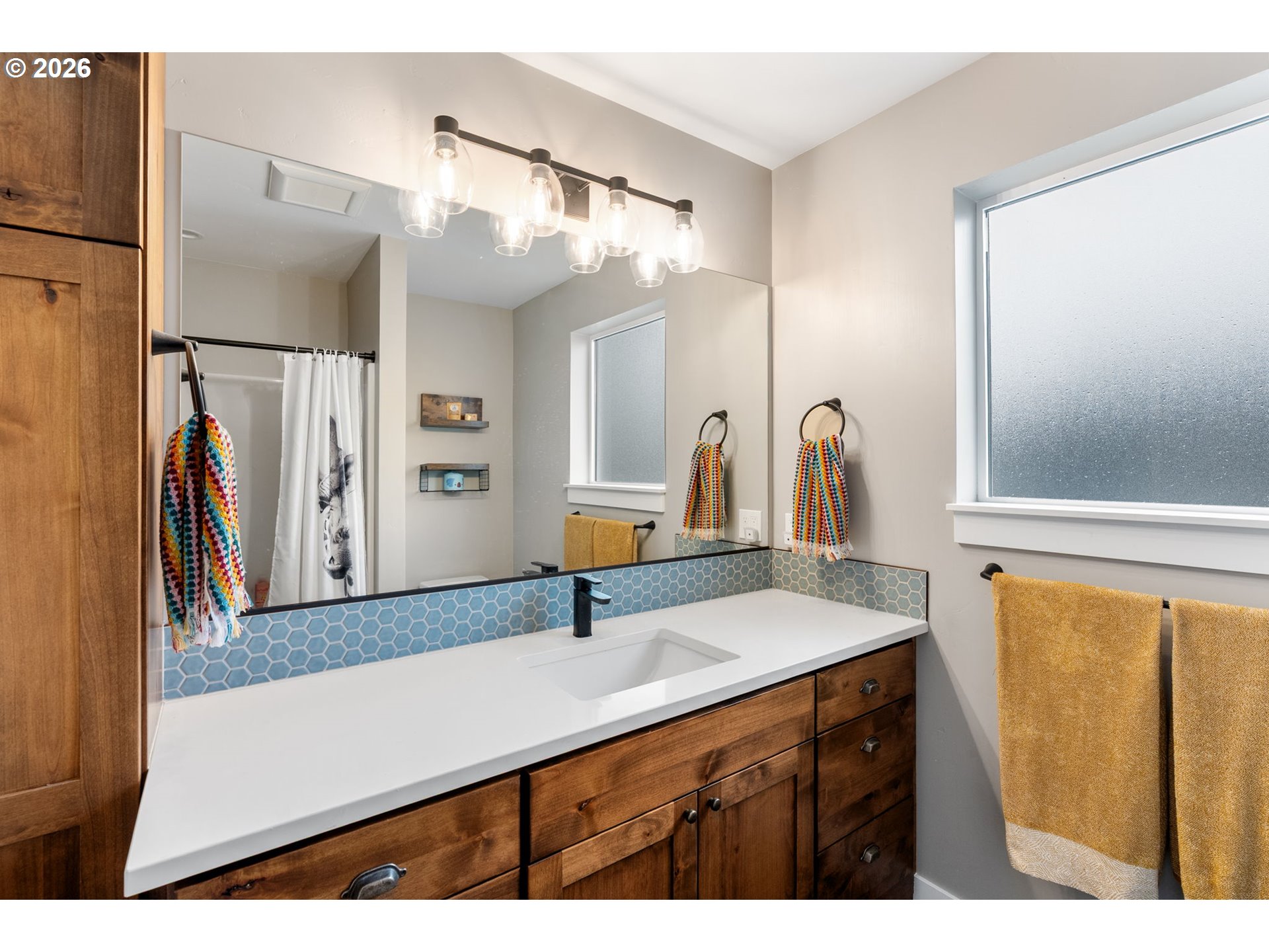 1114 9th Street Hood River, OR 97031 - Photo 28 of 48 a bathroom with a sink and a mirror