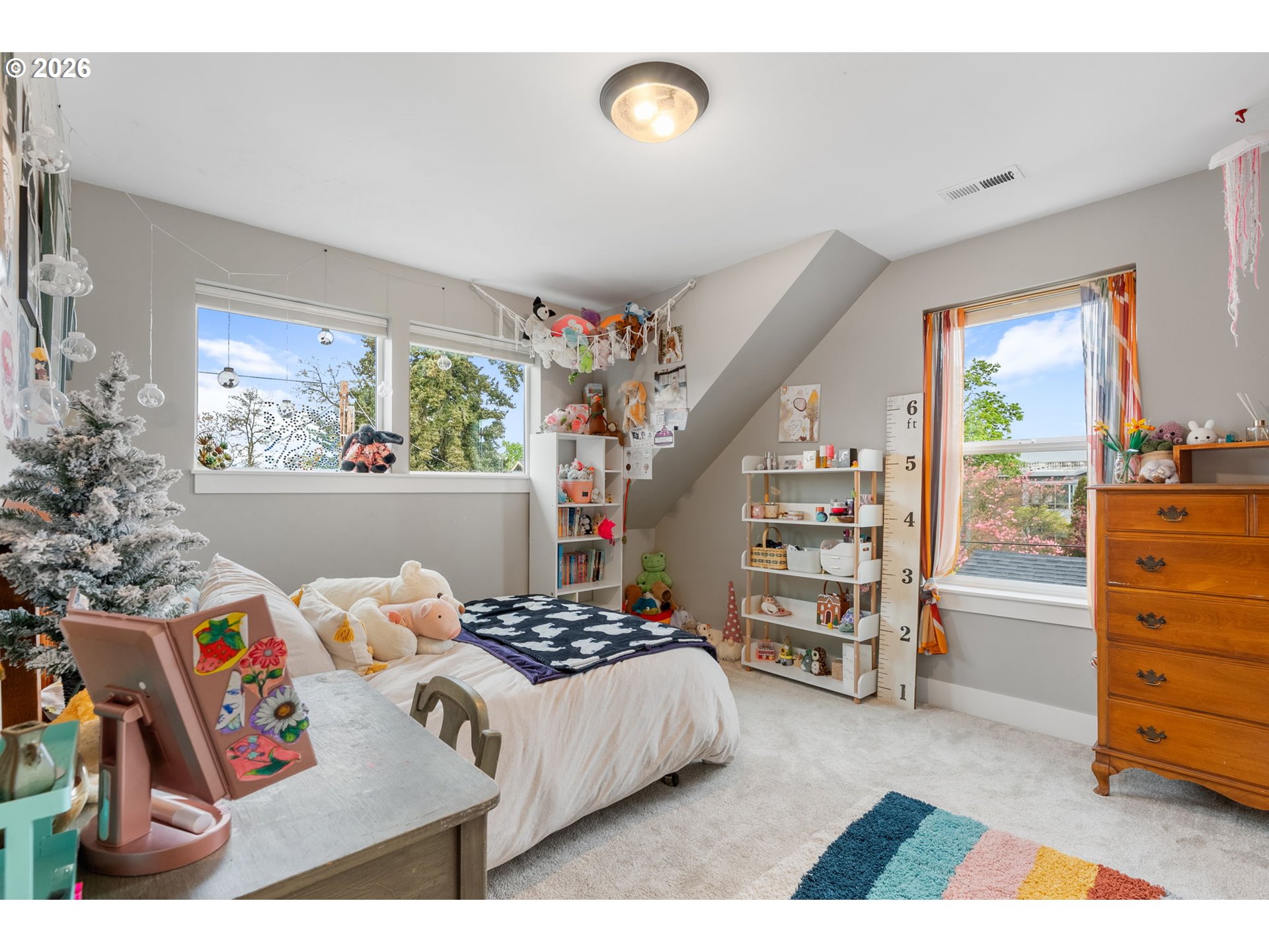 1114 9th Street Hood River, OR 97031 - Photo 30 of 48 a bedroom with furniture and a book shelf