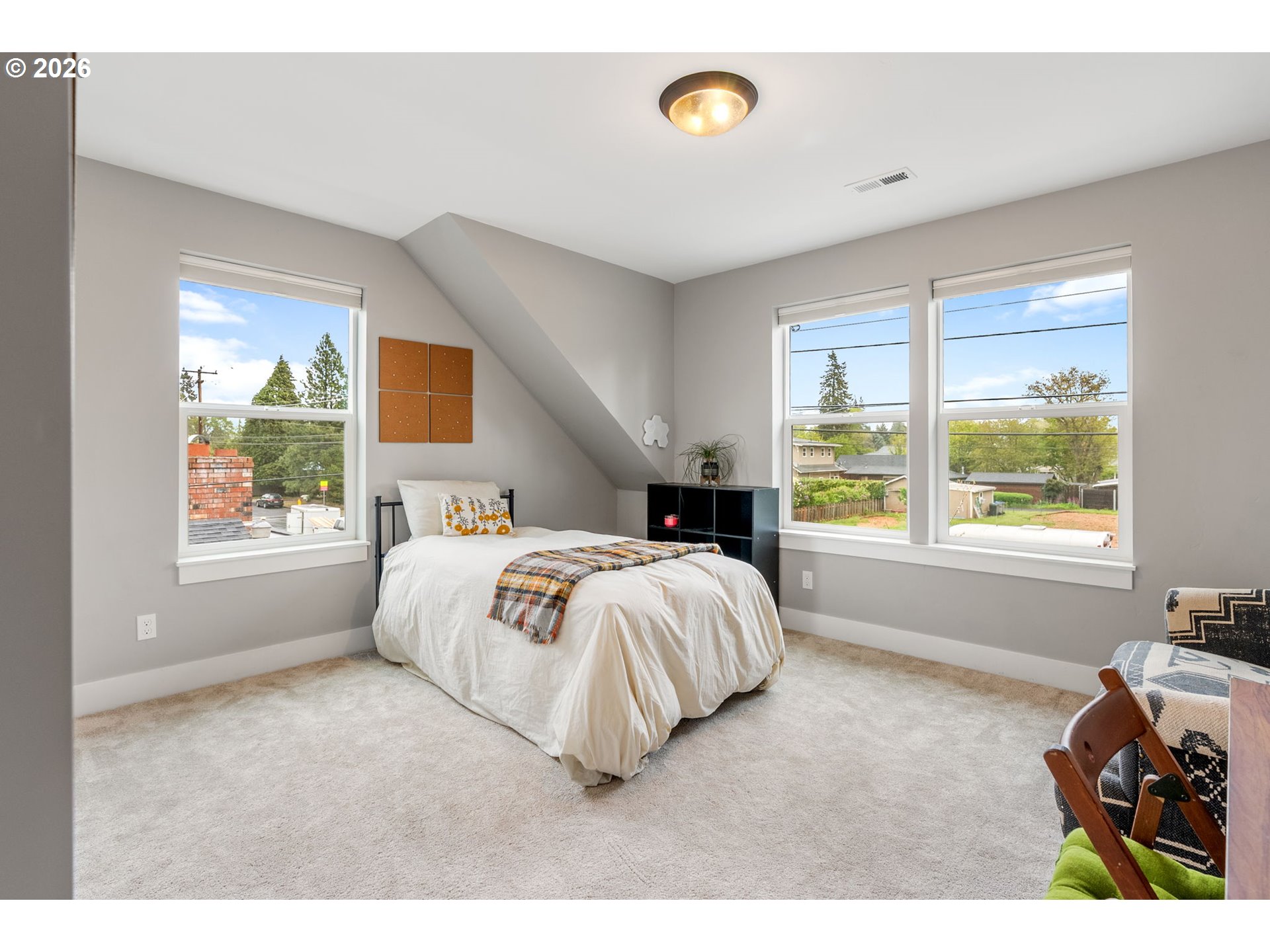 1114 9th Street Hood River, OR 97031 - Photo 32 of 48 a spacious bedroom with a bed and a large window