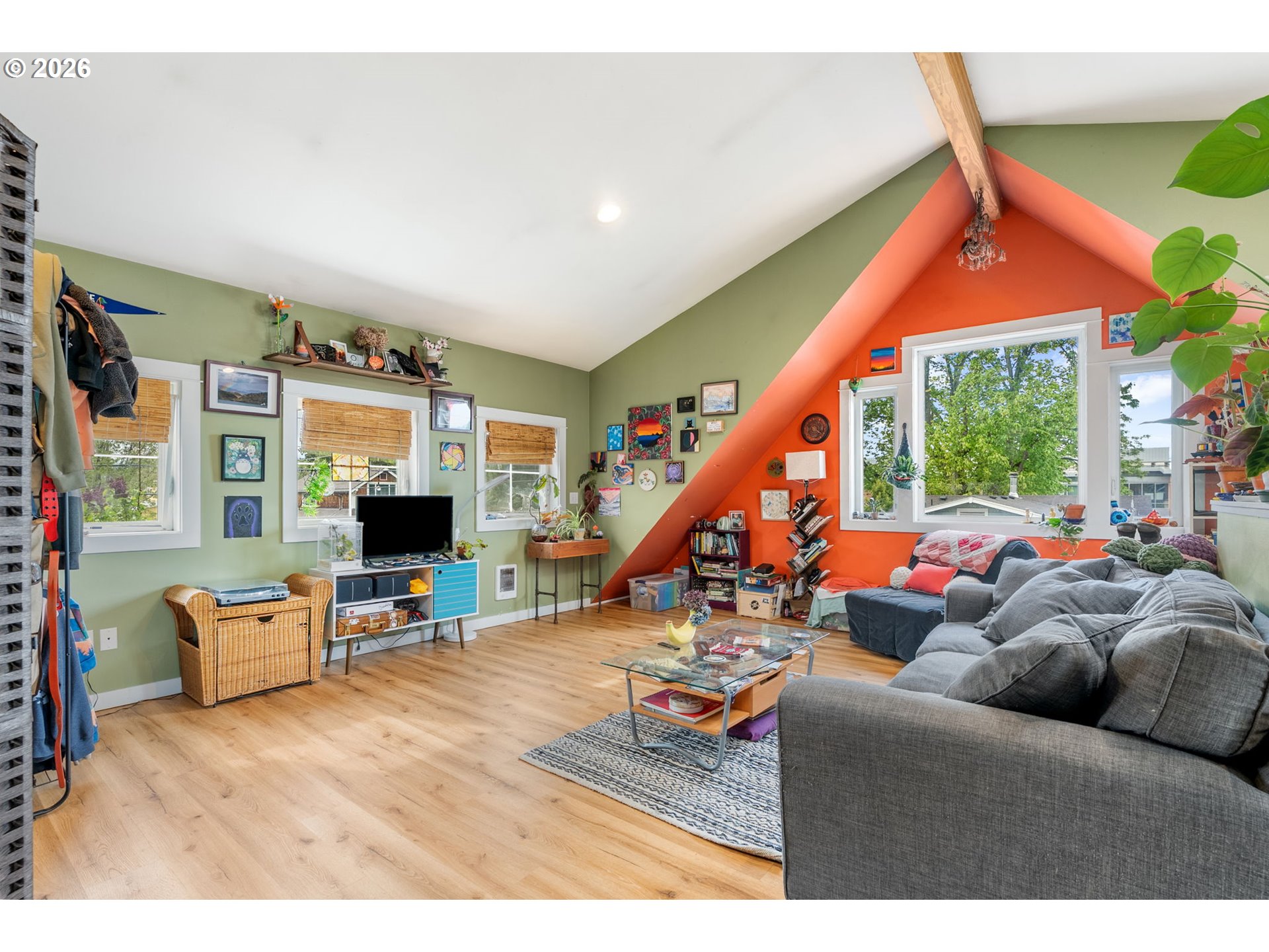 1114 9th Street Hood River, OR 97031 - Photo 39 of 48 a living room with furniture a floor to ceiling window and a flat screen tv