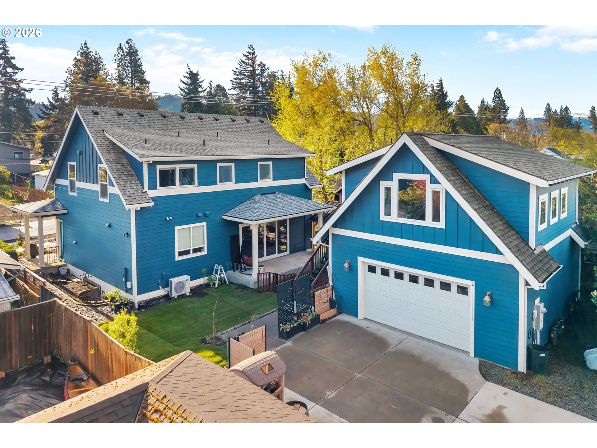 1114 9th Street Hood River, OR 97031 - Photo 46 of 48 a view of a house with a yard and potted plants