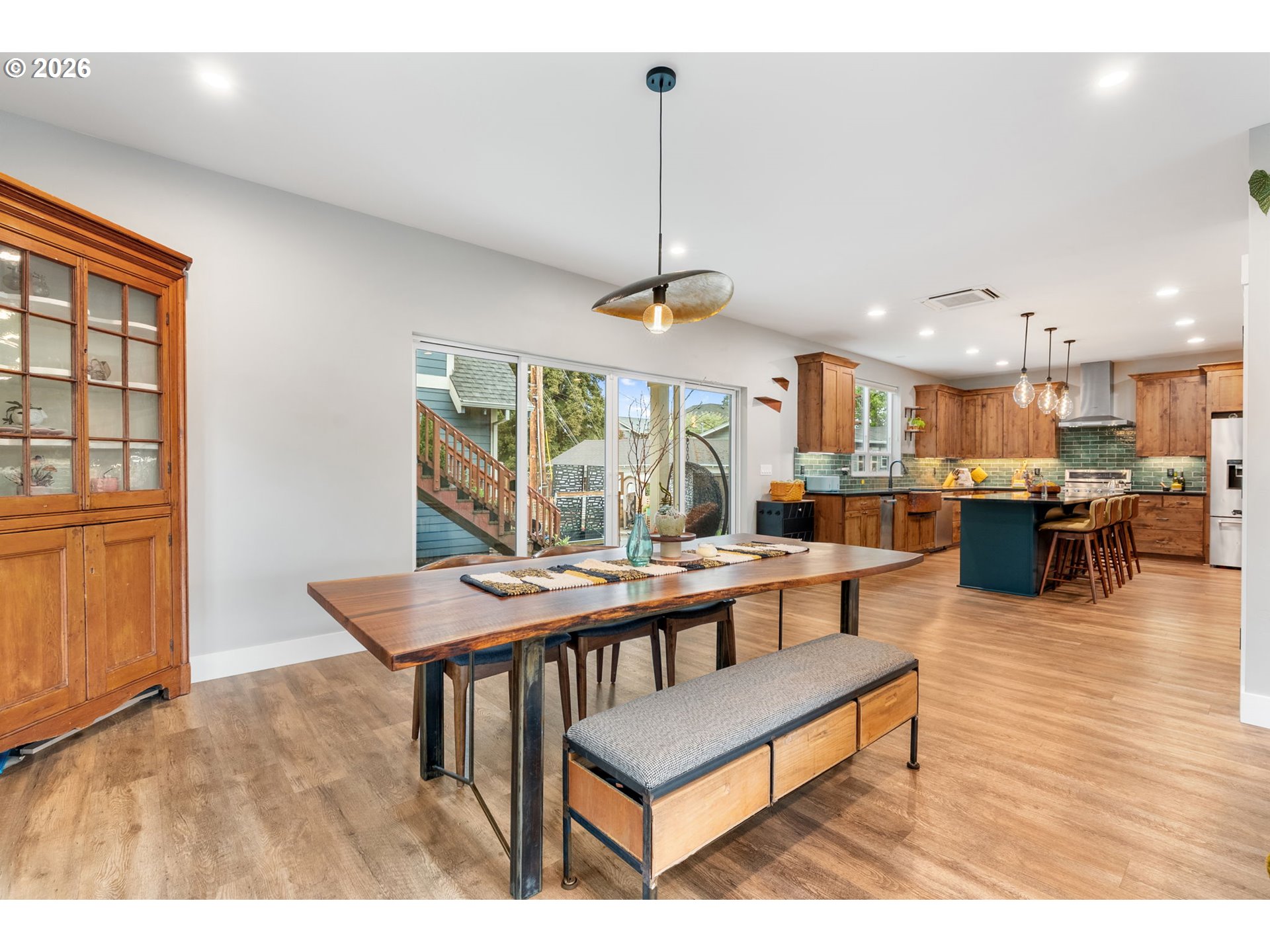 1114 9th Street Hood River, OR 97031 - Photo 5 of 48 a living room with furniture a table and kitchen view