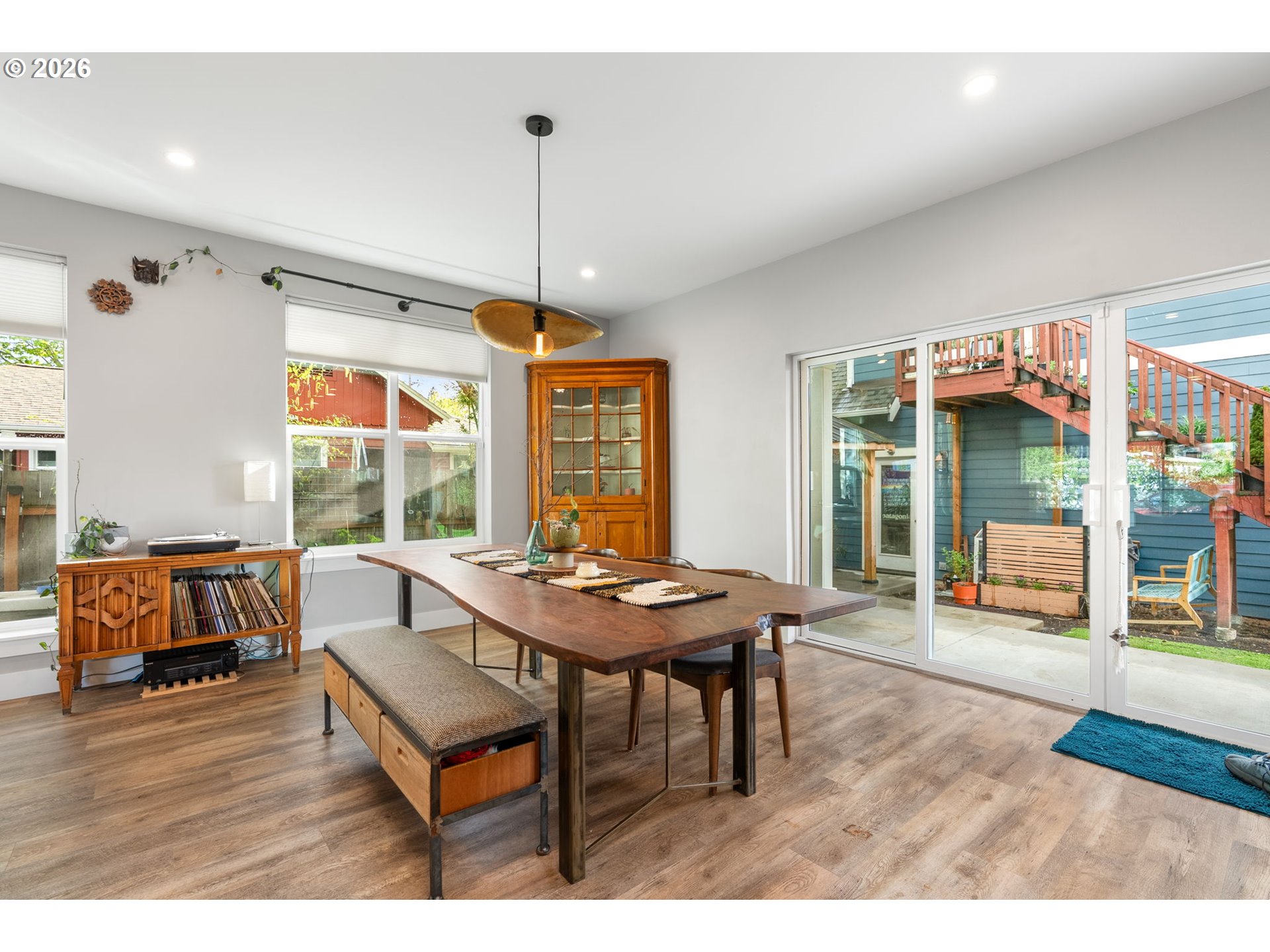1114 9th Street Hood River, OR 97031 - Photo 6 of 48 a dining room with furniture a chandelier and wooden floor