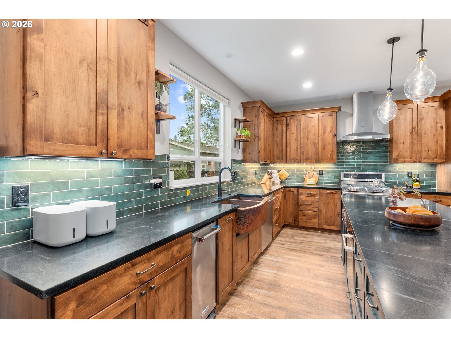 1114 9th Street Hood River, OR 97031 - Photo 9 of 48 a kitchen with a sink a counter top space and appliances
