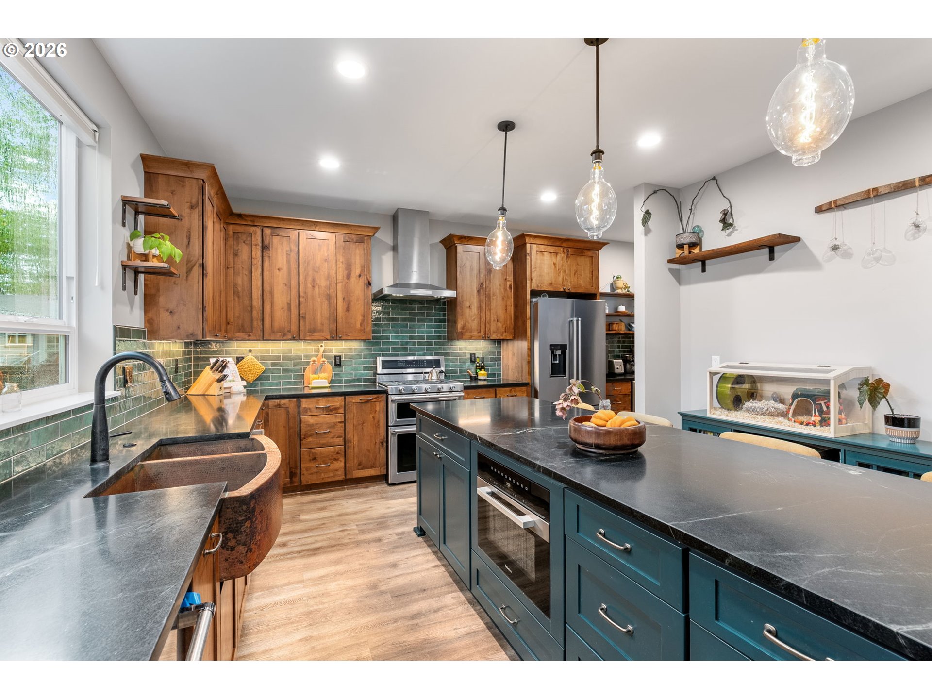 1114 9th Street Hood River, OR 97031 - Photo 10 of 48 a kitchen with granite countertop a sink stove and cabinets