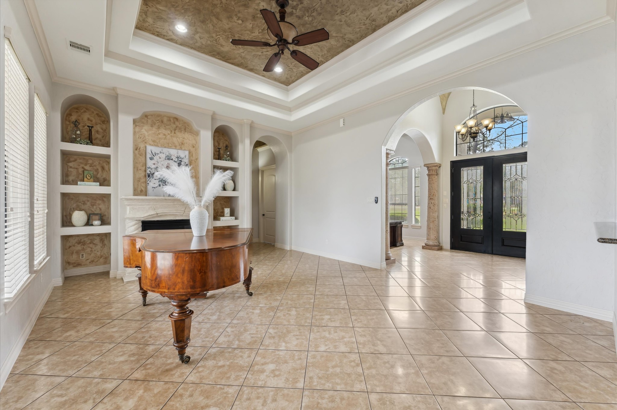 18316 Wisp Willow Way Porter, TX 77365 - Photo 1 of 32 Elegant living room with a stunning chimney and built-in shelves.
