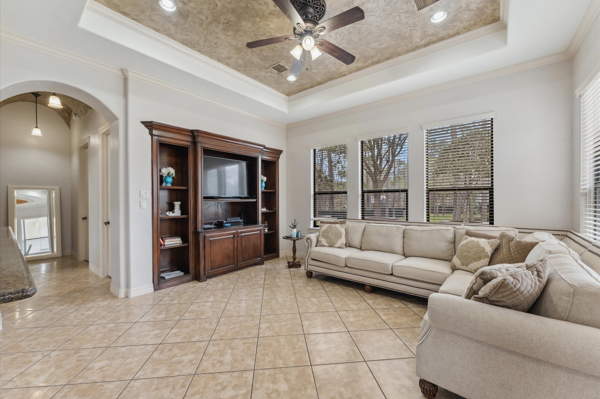 18316 Wisp Willow Way Porter, TX 77365 - Photo 17 of 32 Spacious family room with a custom built-in entertainment center.
