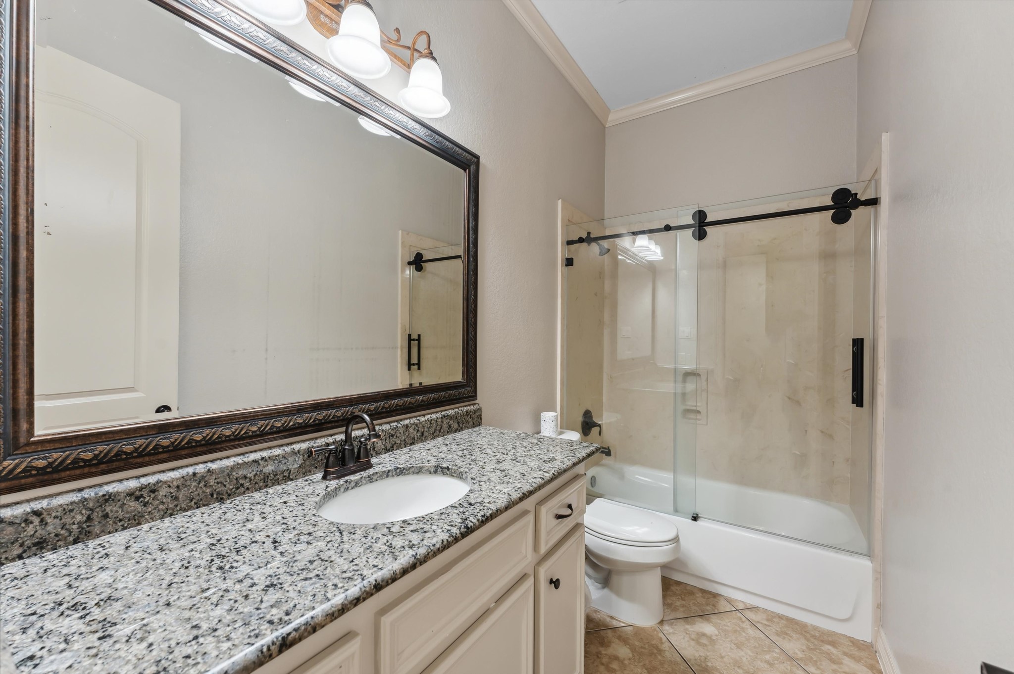 18316 Wisp Willow Way Porter, TX 77365 - Photo 18 of 32 Second full bathroom with rolling glass shower door.