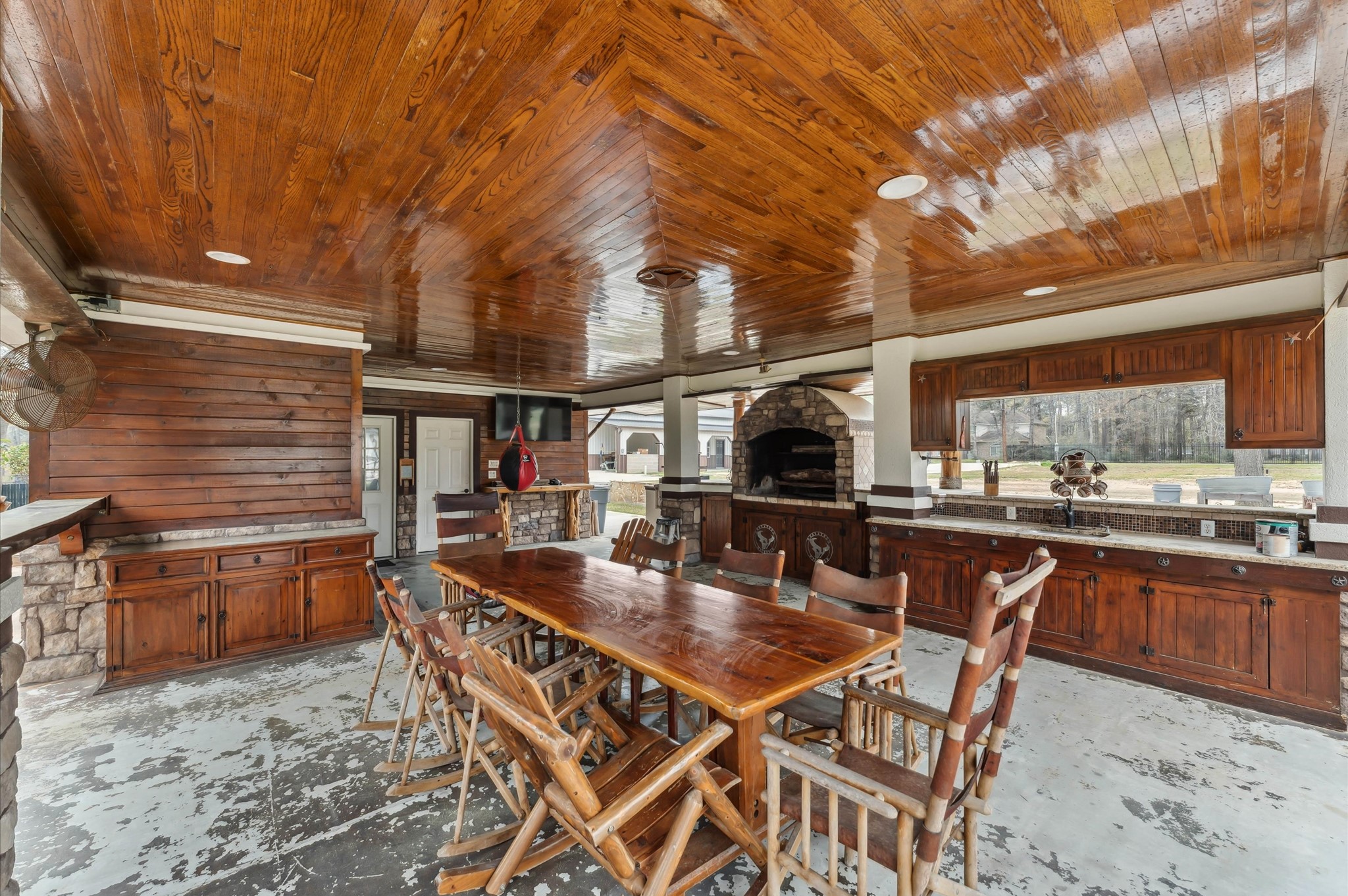 18316 Wisp Willow Way Porter, TX 77365 - Photo 25 of 32 Open-concept outdoor structure with built-in BBQ, sink, and space for dining