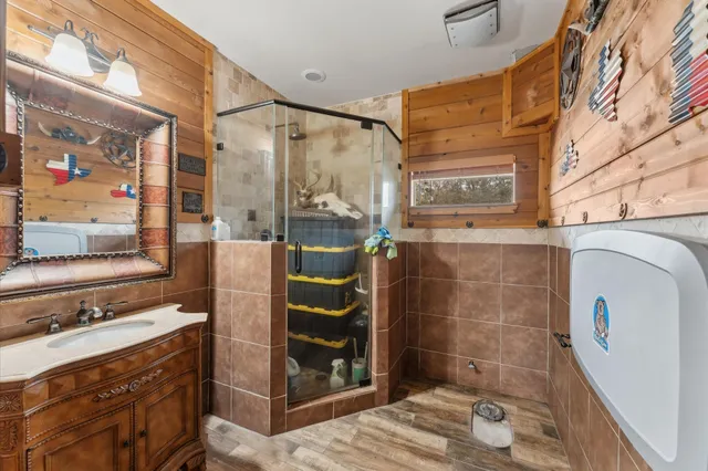 a view of a bathroom with a sink and a shower