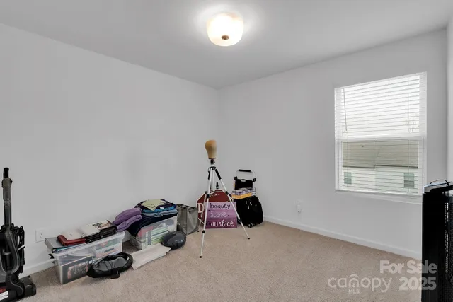 a room with gym equipment and a window