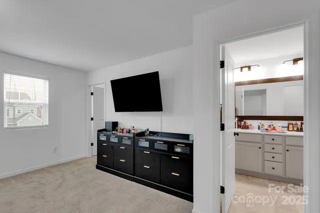 a room with furniture and flat screen tv