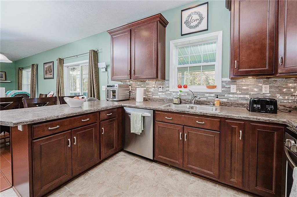 2831 Rte 286 Highway East Indiana, PA 15701 - Photo 13 of 40 a kitchen with stainless steel appliances granite countertop a sink stove and cabinets