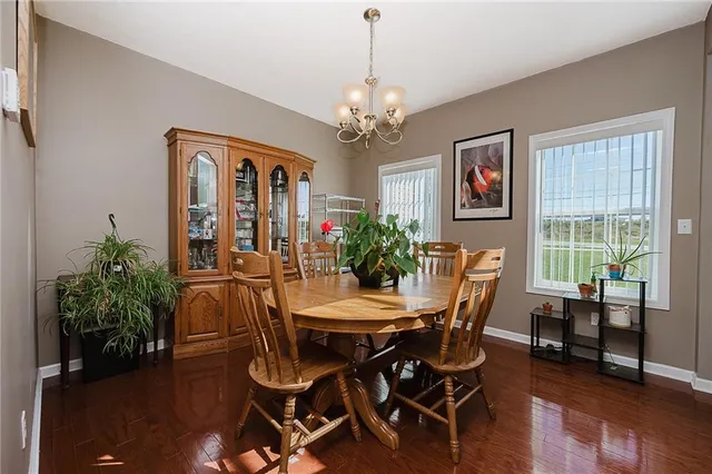 a living room with furniture fireplace and flat screen tv