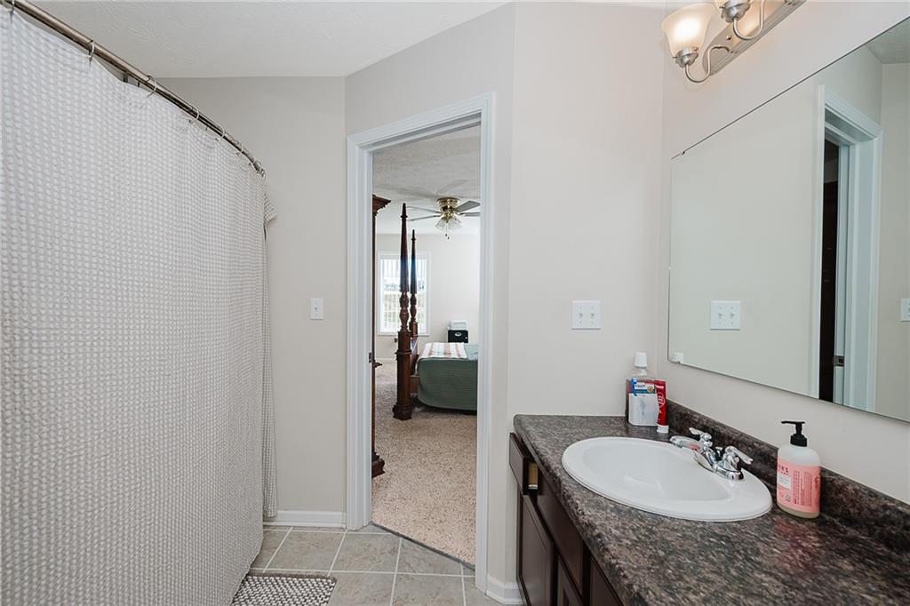 2831 Rte 286 Highway East Indiana, PA 15701 - Photo 30 of 40 a en suite bathroom with a granite countertop sink and a mirror