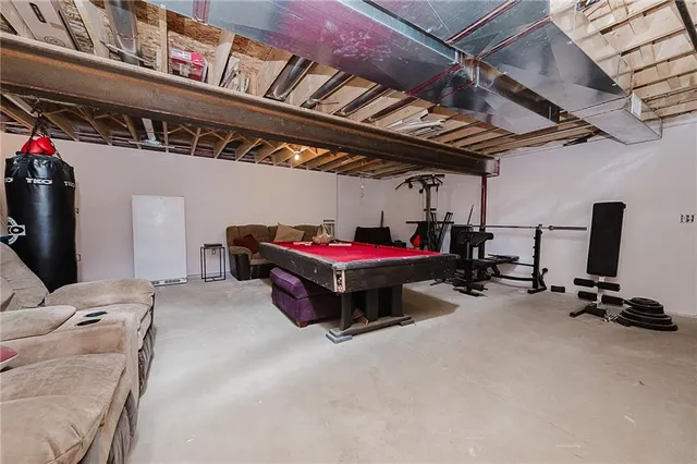 a view of walk in closet with clothes