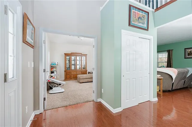 a kitchen with a refrigerator sink and cabinets