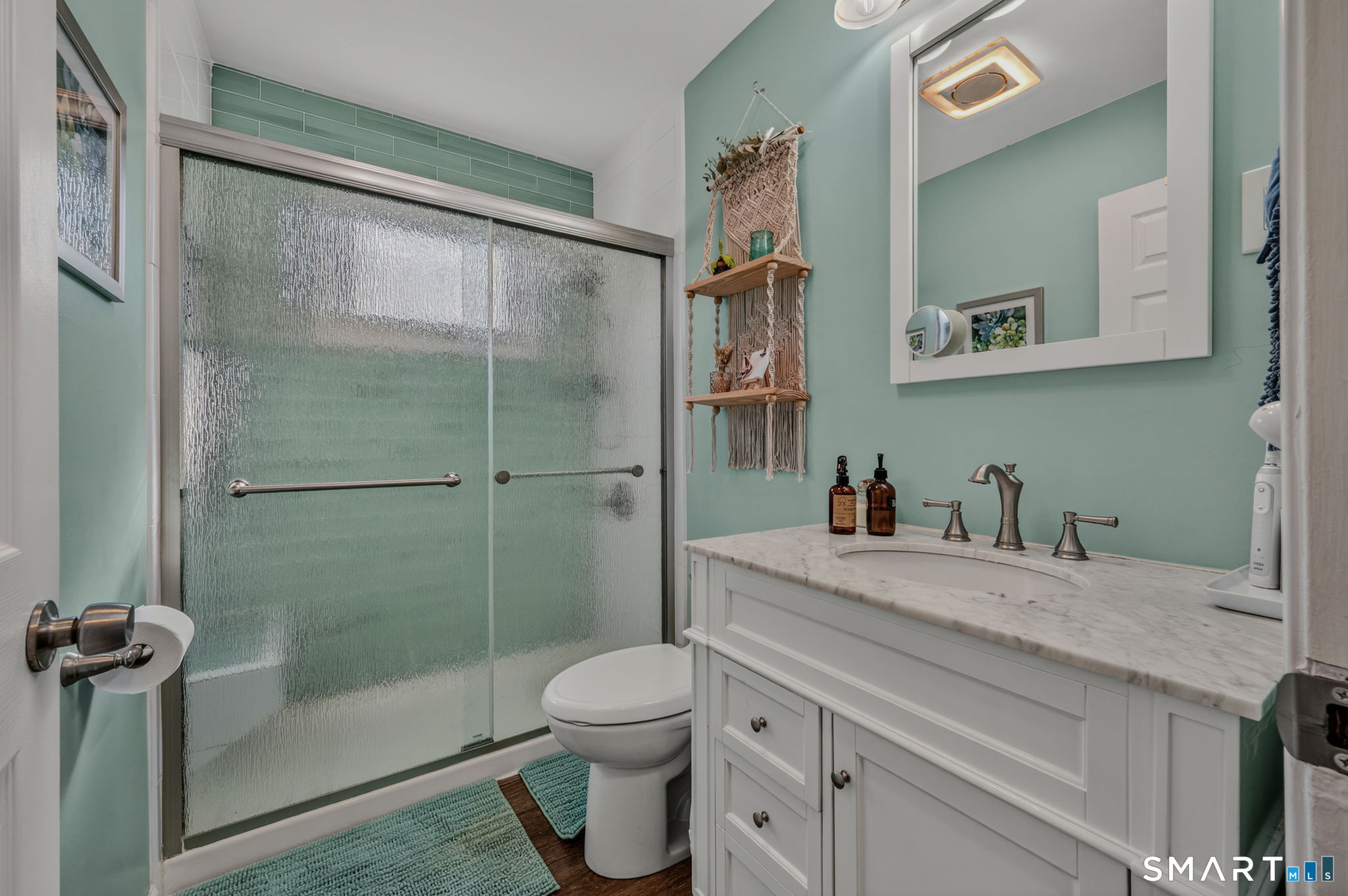 194 Browning Road Norwich, CT 06360 - Photo 13 of 38 a bathroom with a granite countertop bathtub shower sink vanity and toilet