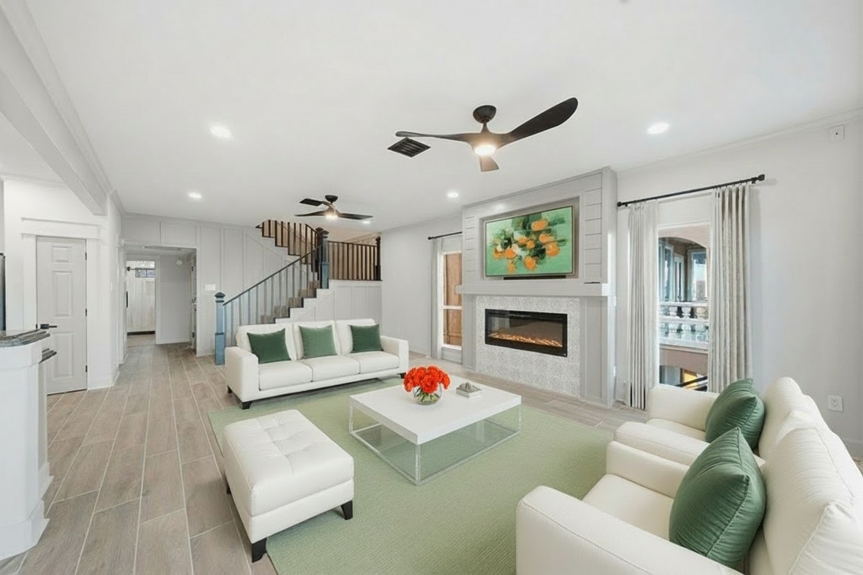 1918 Todville Road Seabrook, TX 77586 - Photo 17 of 41 The bright, open plan living area is anchored by a sleek, modern fireplace and ample room for large gatherings.