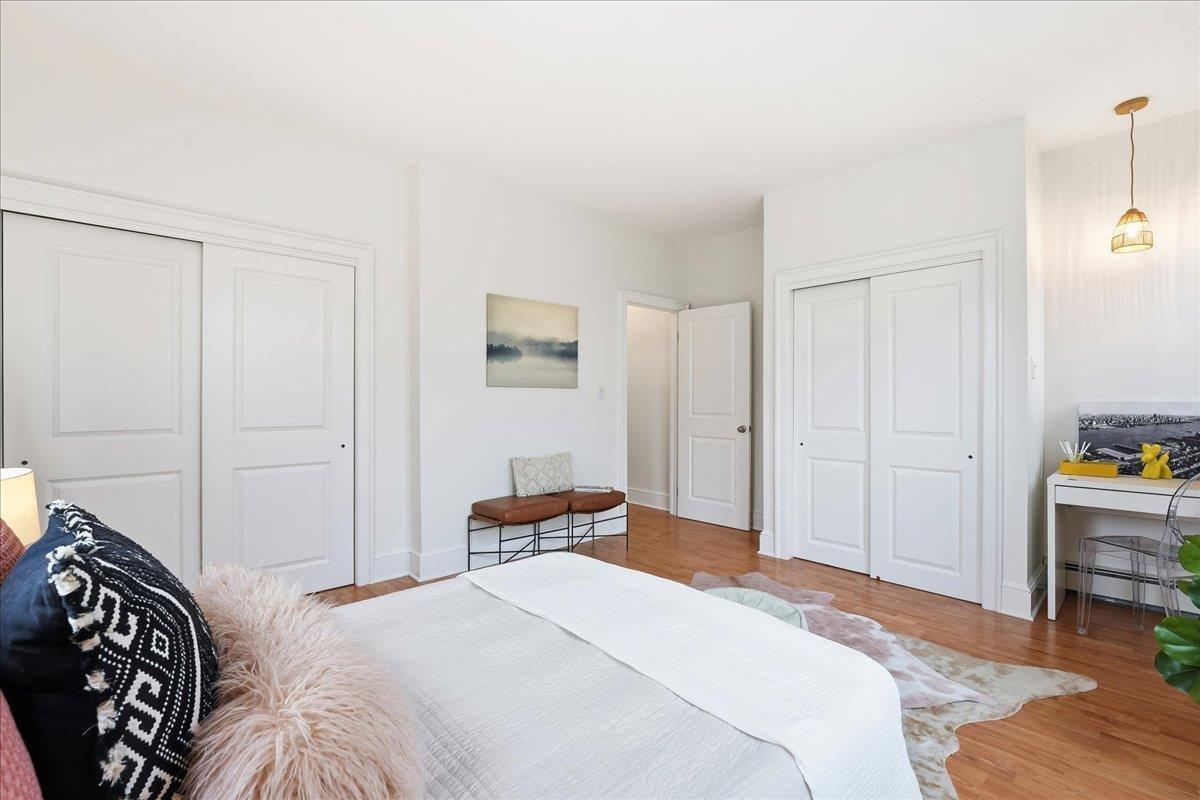 831 Clinton Street, Unit 9 Hoboken, NJ 07030 - Photo 12 of 20 a bedroom with a bed and a closet
