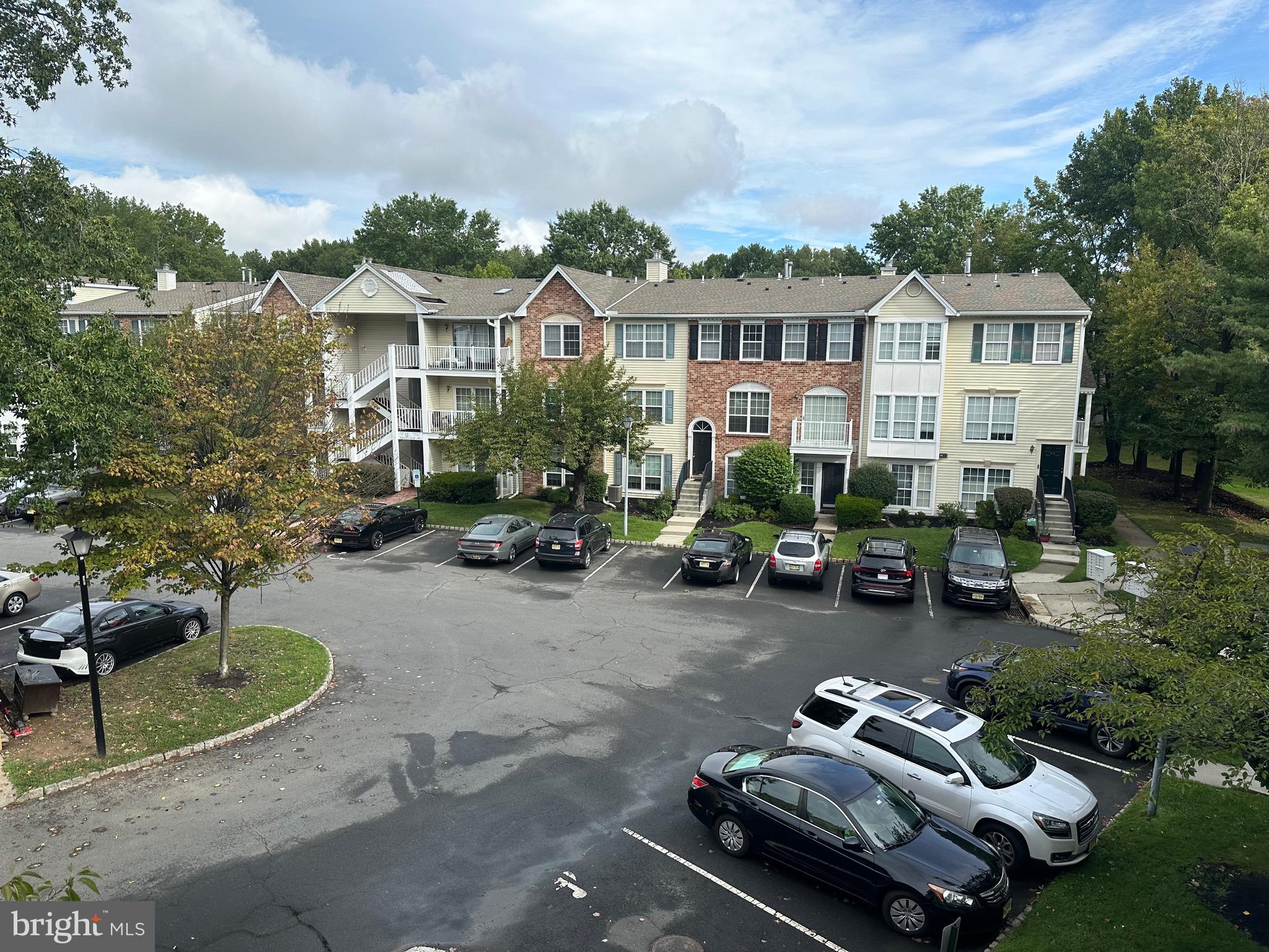 a view of a house with backyard space and sitting area