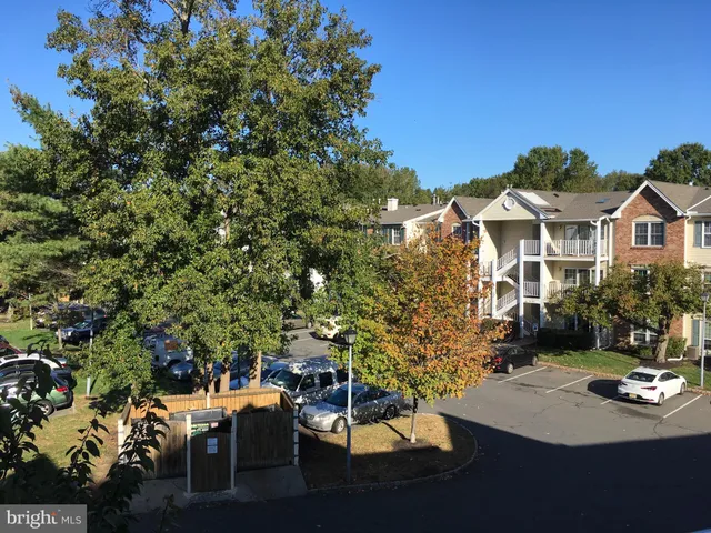a view of a patio with table and chairs and potted plants