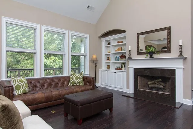 a living room with furniture and a fireplace