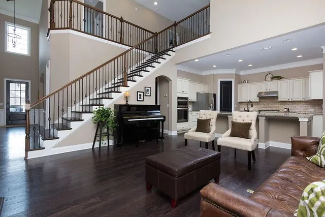 a living room with furniture or kitchen and a wooden floor