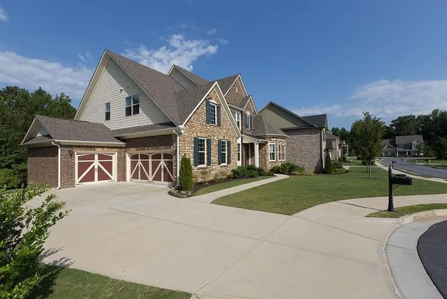 a view of house with yard and green space