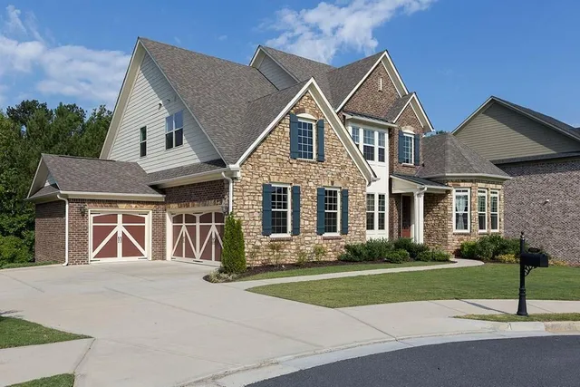 a front view of a house with garden