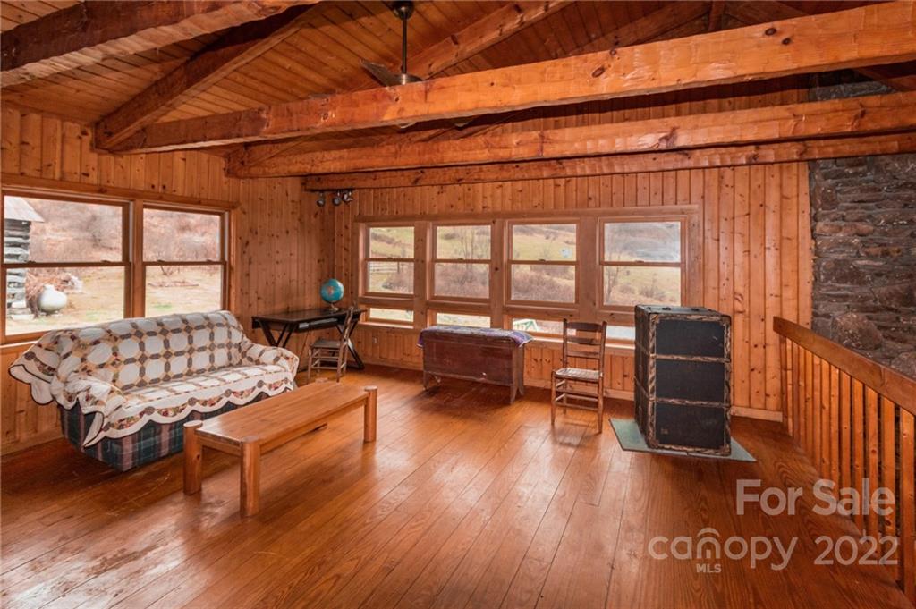 624 James Chapel Road Clyde, NC 28721 - Photo 11 of 46 a living room with furniture and a wooden floor