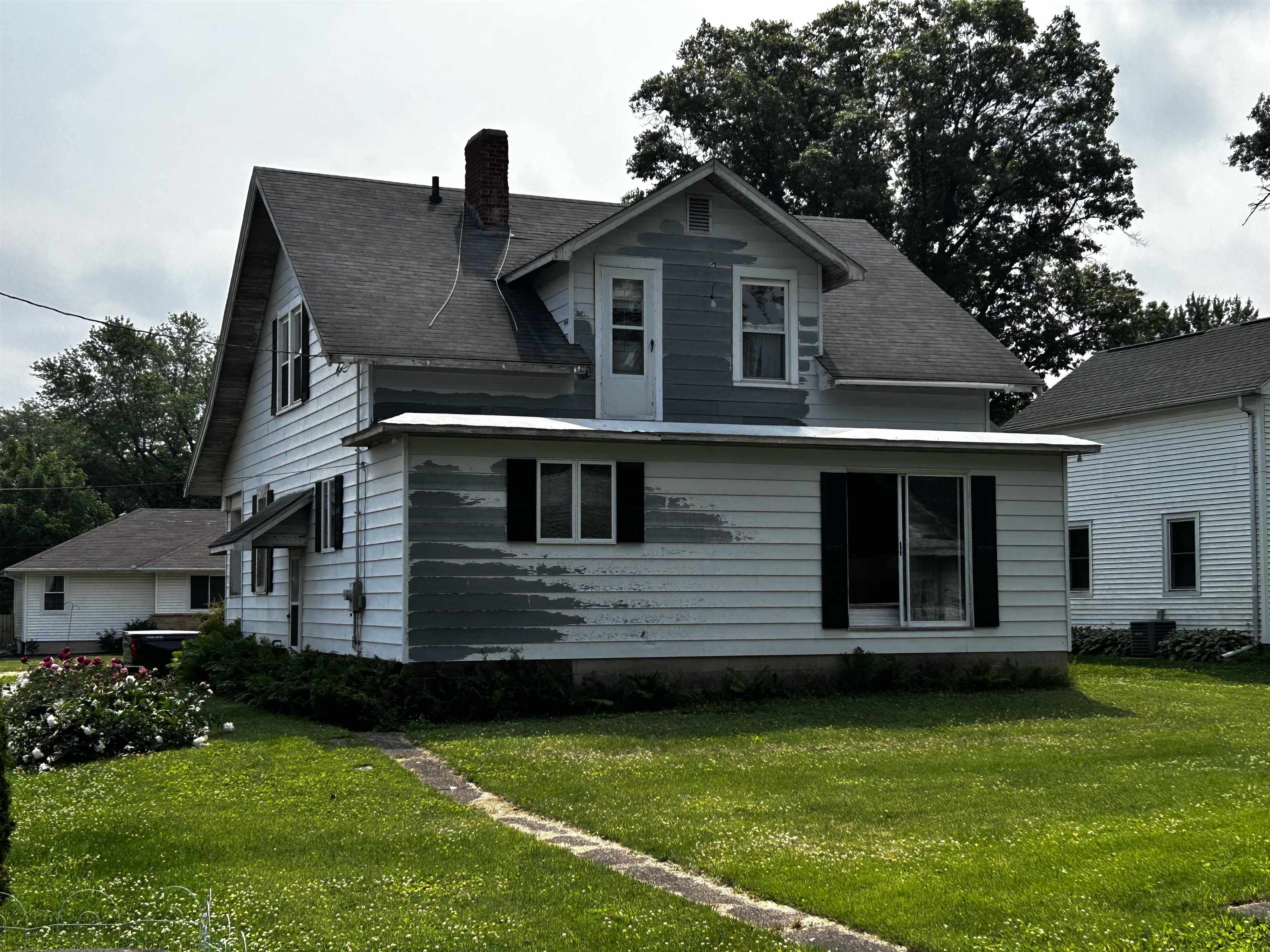 106 3rd Avenue Forreston, IL 61030 - Photo 15 of 18 a front view of a house with a garden